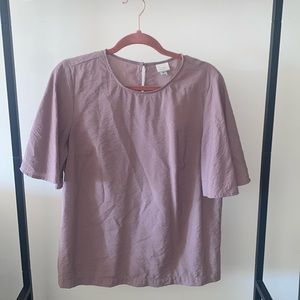 Light purple blouse.